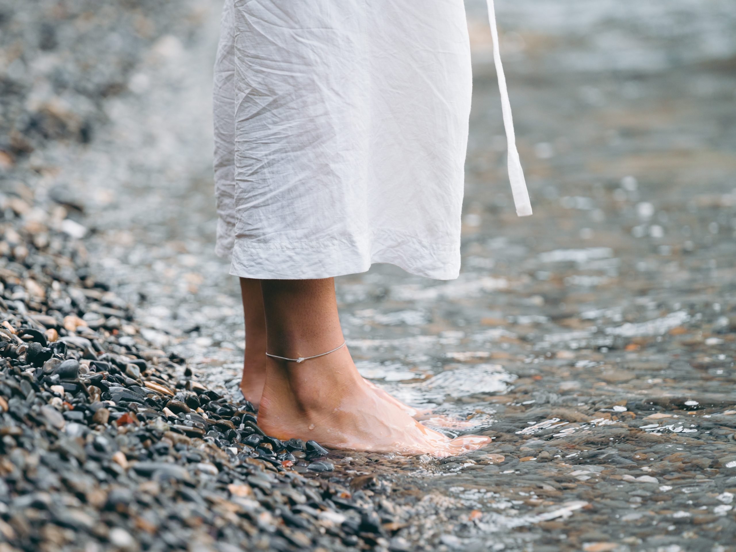 barefoot woman in water