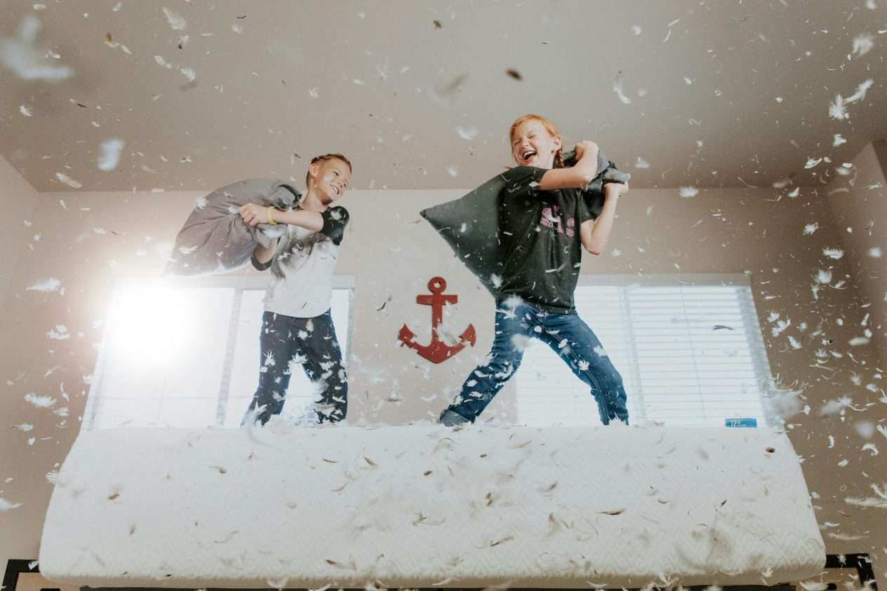 Kids jumping on bed